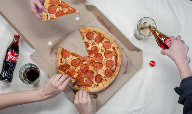 Pizza and coke on a table