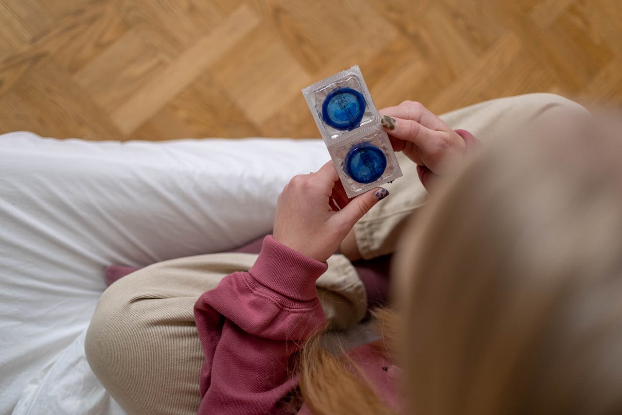 Woman holding condoms